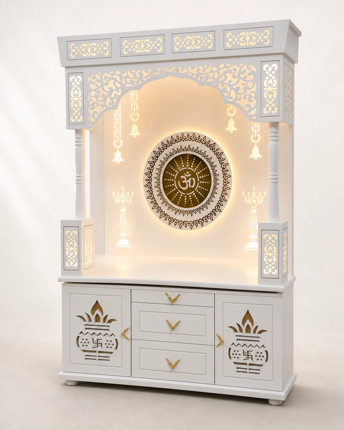 Mandir unit with a round Om mandala medallion, kalash and bell motifs and lotus-carved drawer fronts.