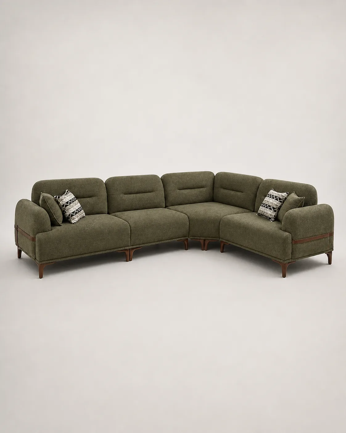 Olive green L-shaped sofa with leather strap arm detail.