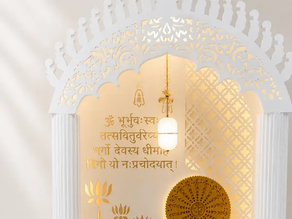 Close-up of the gold sunburst medallion and backlit mantra panel