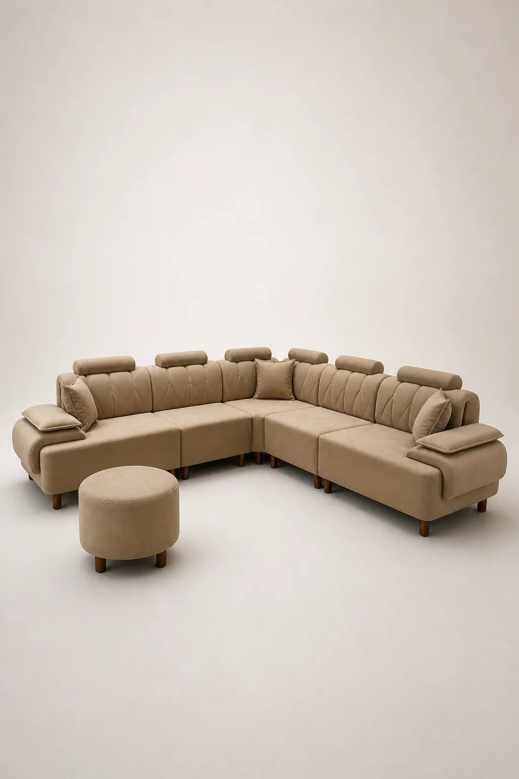 Taupe diamond-stitched channel-tufted L-shaped sofa with round pouf.