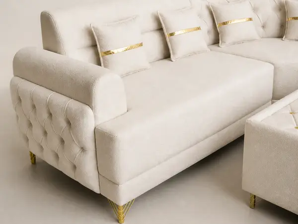Close-up of diamond tufting detail on boucle sofa arm