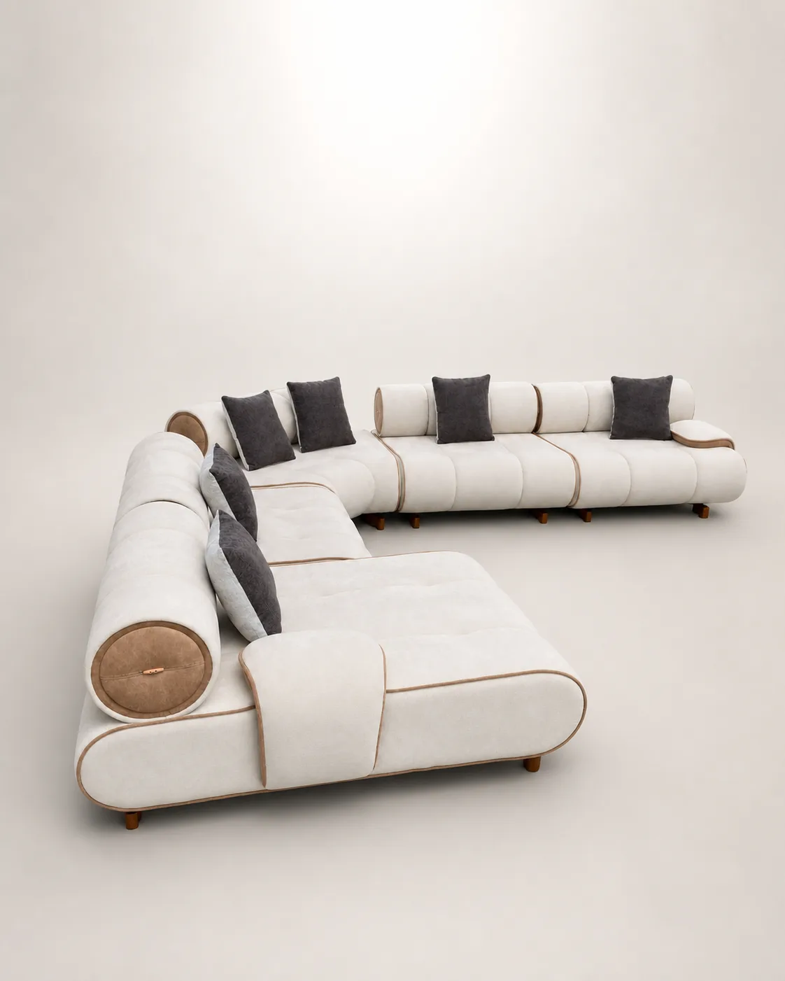 Off-white L-shaped sofa with tubular bolster backrests and tan leather trim.