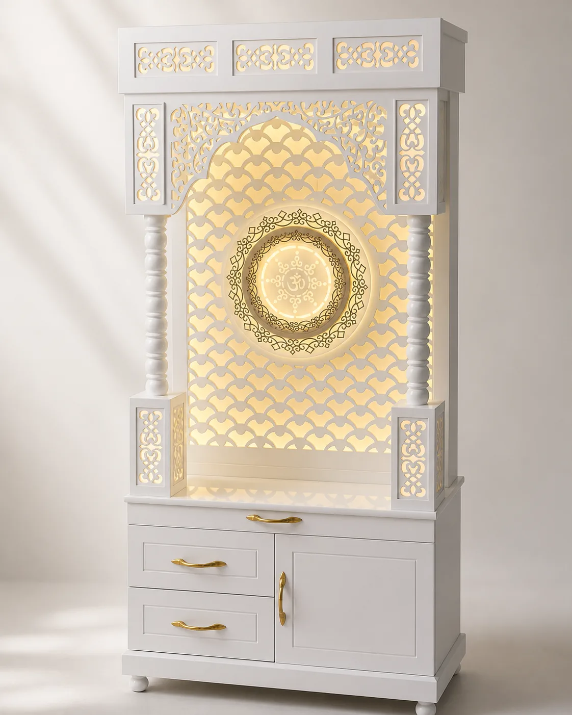 White mandir unit with a scalloped fish-scale jaali arch and gold rosette medallion.
